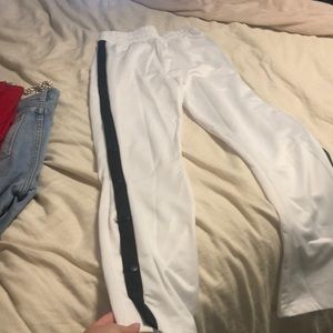 Garage track pants with buttons up the side